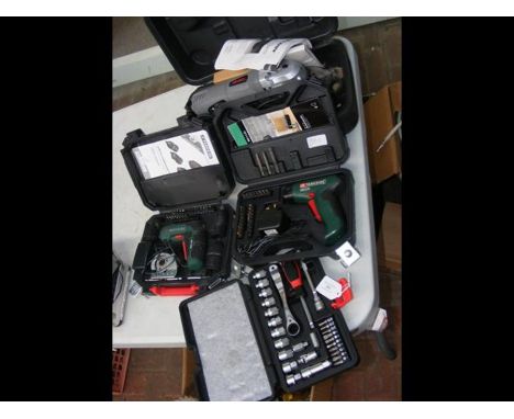 A new boxed multi function saw, together with two multi tools and a socket set 