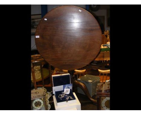 A 70cm diameter Georgian mahogany snap-top tripod table   