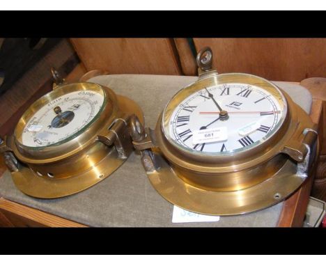 A reproduction ships barometer and clock by Plastimo