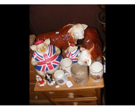 A medley of Butcher's shop advertising collectables comprising two 'Best of British' pigs and two ceramic bulls, together wit