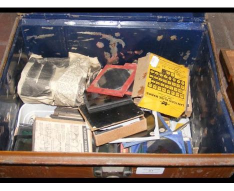 A metal trunk containing collectable magic lantern slides