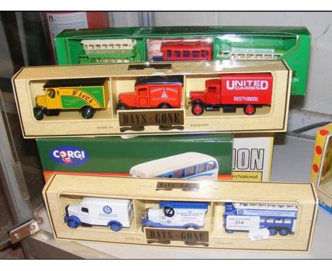 Boxed Corgi Island Transport coaches, together with others