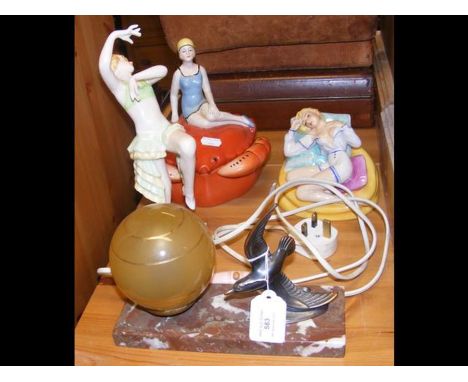 A 1930's table lamp with mounted seagull, together with three Art Deco style figures 