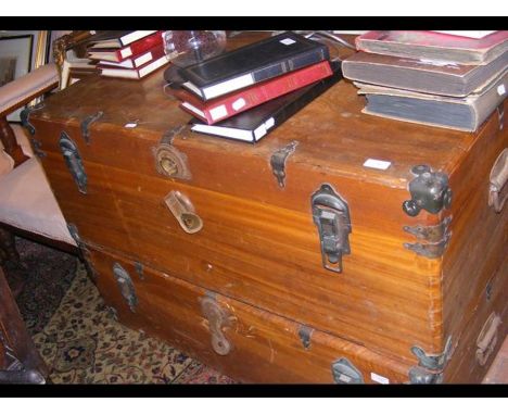 A metal bound trunk with side handles