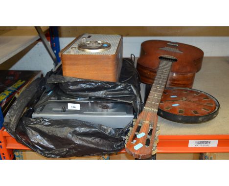 Record player, acoustic guitar, a radio and a clock