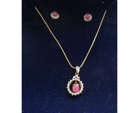 Gold ruby & diamond pendant on chain with matching earrings