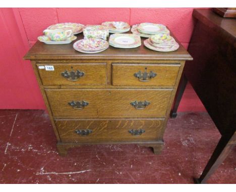 Small oak chest of 2 over 2 drawers on bracket feet