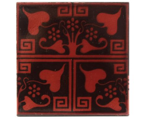 Lewis F Day for Pilkington, three floral tiles, circa 1895 to 1902, including Greek Ivy printed tile, in red, 15cm square (3)