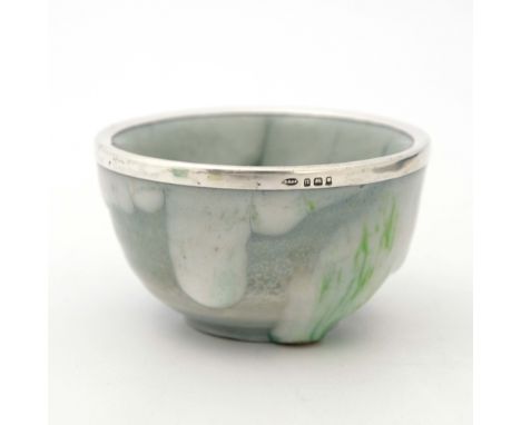 Charles Noke and Harry Nixon for Royal Doulton, a Chang Titanian bowl, 1928, rounded with silver mount, green jade type drip 