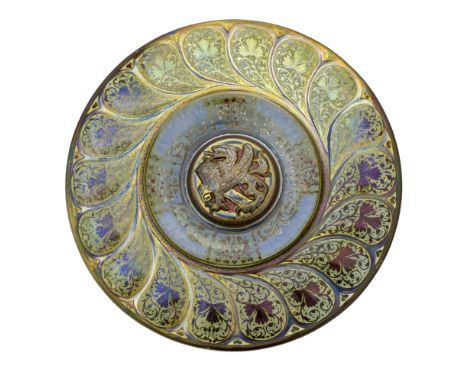 Gordon Forsyth for Pilkington, a large Royal Lancastrian lustre Evangelist Alms dish, 1908, the central boss modelled in reli