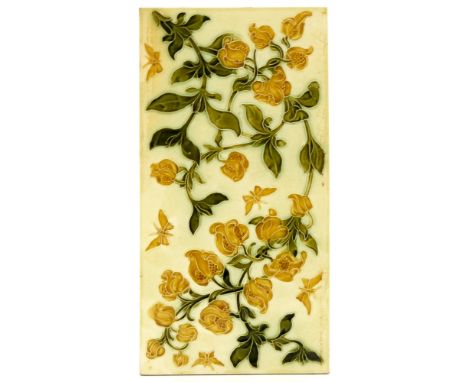 Lewis F Day for Pilkington, a large tile panel, circa 1901, yellow flowers and butterflies, on green leafy stalks, 31cm x 15.