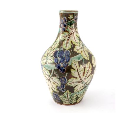 Della Robbia, an art pottery vase, ovoid bottle form, sgraffito decorated with fruiting grape vines, incised marks painted JP