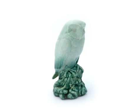 Richard Joyce for Pilkington, a Royal Lancastrian figure of an Owl, modelled perched on a rusticated stump, matt jade turquoi