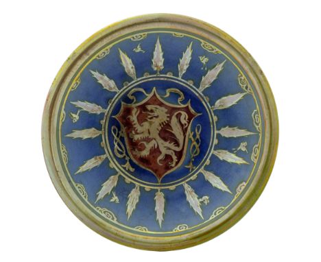 Gordon Forsyth for Pilkington, a Royal Lancastrian heraldic lustre dish, 1908, circular with everted rim, painted with a cent