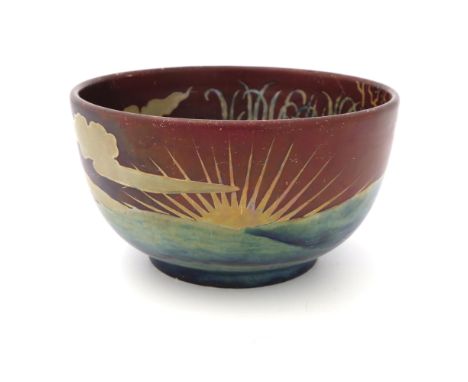 Zsolnay, Pecs, a lustre bowl, circa 1915, rounded form, painted with sunrise landscapes in iridescent turquoise and silver on