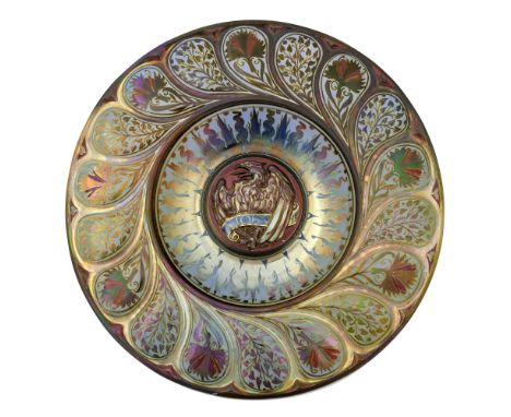 Gordon Forsyth for Pilkington, a large Royal Lancastrian lustre Evangelist Alms dish, 1909, the central boss modelled in reli