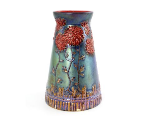 Zsolnay, Pecs, a lustre vase, circa 1915, conical form, relief moulded with red chrysanthemums rising over a rusticated fence