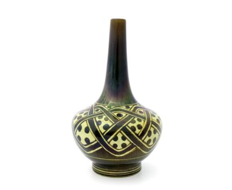 Gordon Forsyth for Pilkington, a Royal Lancastrian lustre vase, 1919, footed bulbous bottle form, painted with a geometric kn