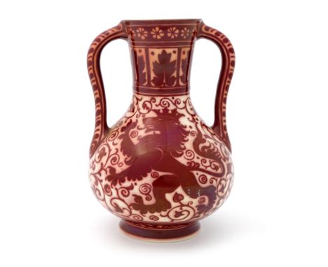 Richard Joyce for Pilkington, a Royal Lancastrian red lustre twin handled vase, 1907, baluster form, painted with crowned ram