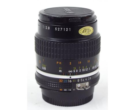 Nikon Micro-NIKKOR 55mm 1:2.8 camera lens, serial no. 527121 