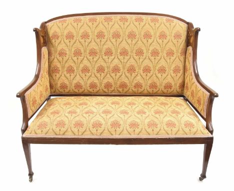 Art Nouveau mahogany inlaid salon settee, inlaid with stylised foliate panels and with a mustard ground Liberty style padded 