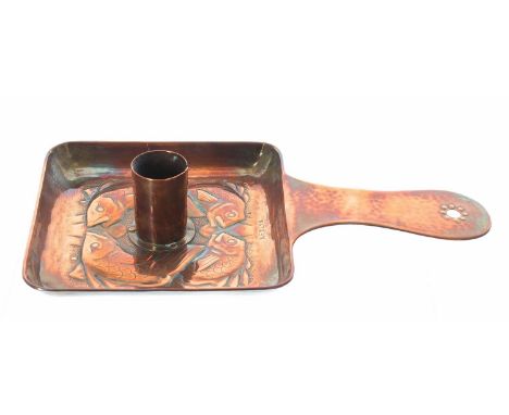 Newlyn copper chamber stick,&nbsp;repousse decorated with fish on a square base, stamped Newlyn, 8.75" long including handle 