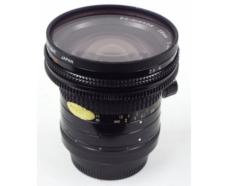 PC-NIKKOR 28mm 1:3.5 camera lens, serial no. 185371, with Hoya skylight filter, in Nikon CL-34A carry case 