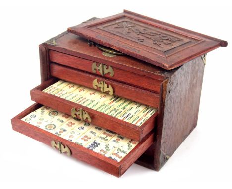 Wooden cased mahjong games set, applied with brass corner mounts, the box 9.5" wide, 6.75" high 
