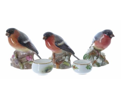 Three Royal Worcester porcelain Bullfinch figures, model no. 3238, 2.75" high; together with a pair of miniature Royal Worces