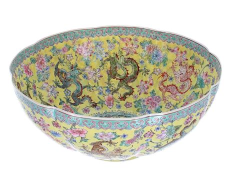 Fine quality Chinese egg shell famille jaune porcelain bowl, of circular lobed form decorated with dragons, bearing seal mark