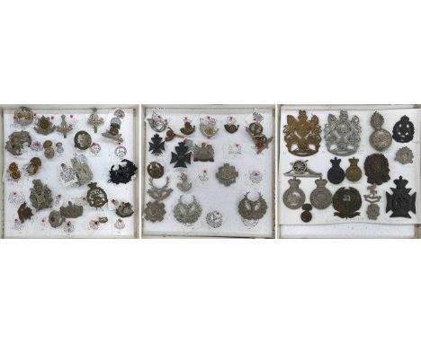 Collection of reproduction military cap badges, various regiments and corps including artillery  **most identified by the ven