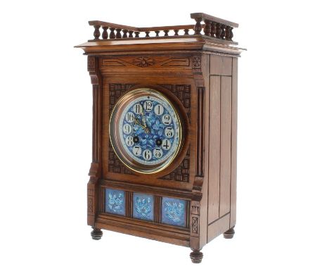 Aesthetic oak two train mantel clock, the blue and white foliate dial with Arabic numerals over a triple panelled front inset