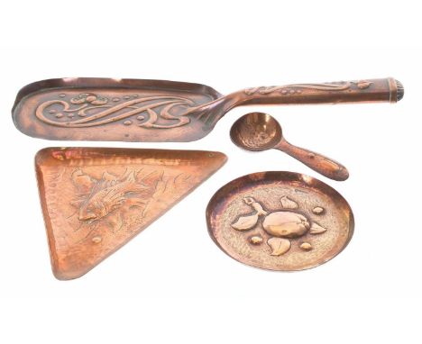 Three pieces of Newlyn copper including&nbsp;a fish design triangle 6" tray,&nbsp;circular dish and a a caddy spoon, each pie