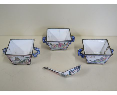 Three Chinese enamel square form cups with twin handles, each raised upon four feet, also an enamel spoon- each cup with dama