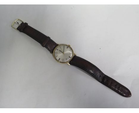 A vintage gents automatic Omega wristwatch with omega stamped button but replacement leather strap, case, approx 33mm wide in