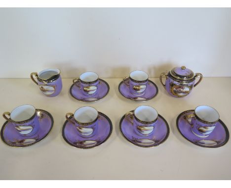 A set of six Noritake landscape decorated coffee cans and saucers with sugar bowl and milk jug, some small usage wear general