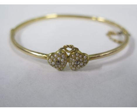 A gilt metal pearl heart bangle set with two small diamonds - 7cm x 6cm - approx 5.8 grams, old repairs/split to bangle, all 
