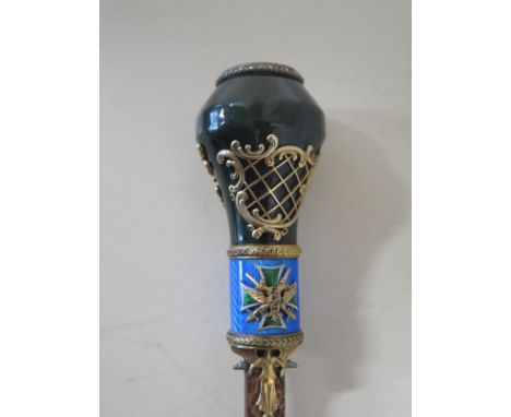 A Faberge sword stick with jade top handle decorated in green enamel with a double-headed eagle and diamond surround - the se