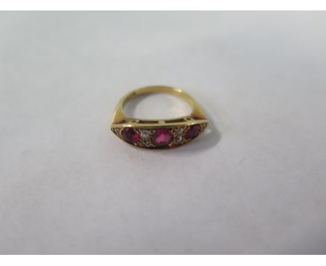 An 18ct yellow gold ruby and diamond ring, size J, approx 3.7 grams, general wear consistent with age, small chipping to ston