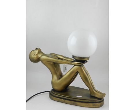 Art Deco style lamp, fashioned as reclining nude holding glass bowl. H:38cm
