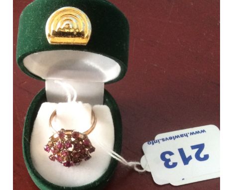 A 14 k ruby cluster ring with one ruby missing