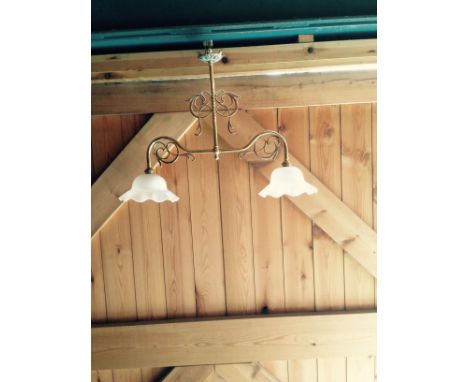 Pair of two light brass electroliers with milk glass frilled shades.