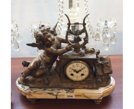 Good French gilt metal mantle clock with silk suspension