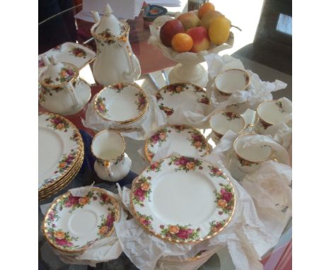 Part tea, coffee and dinner service of Royal Albert Country Flowers 6-9 setting and tea, coffee pots etc.
