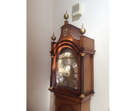 Husband of Hull oak longcase clock with pagoda top,brass face, eight day movement and date aperture ammended
