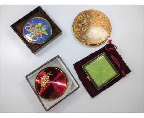 A Stratton compact with box and two others, plus hand mirror 