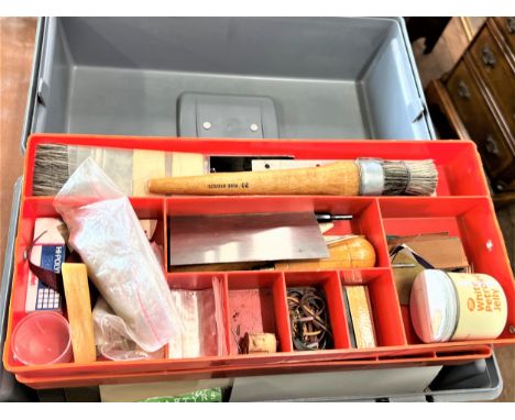 A Box of Book binding tools for laying gold leaf. In a modern toolbox. 