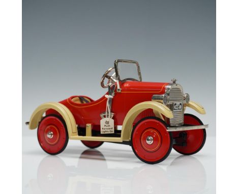 A limited edition collectible toy car model replica capturing the charm of early 20th century pedal car. This car features a 