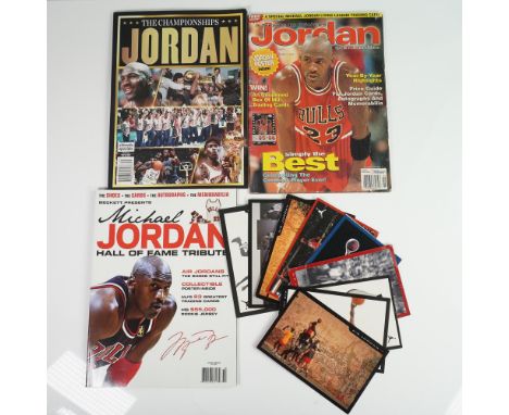 Thirteen-piece Michael Jordan memorabilia collection featuring a mix of Air Jordan promotional cards, timeline shoe charts, a