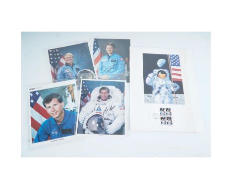 Collection of five signed 8x10" NASA promotional photographs featuring astronauts George D. Nelson, Anthony W. England, Marti